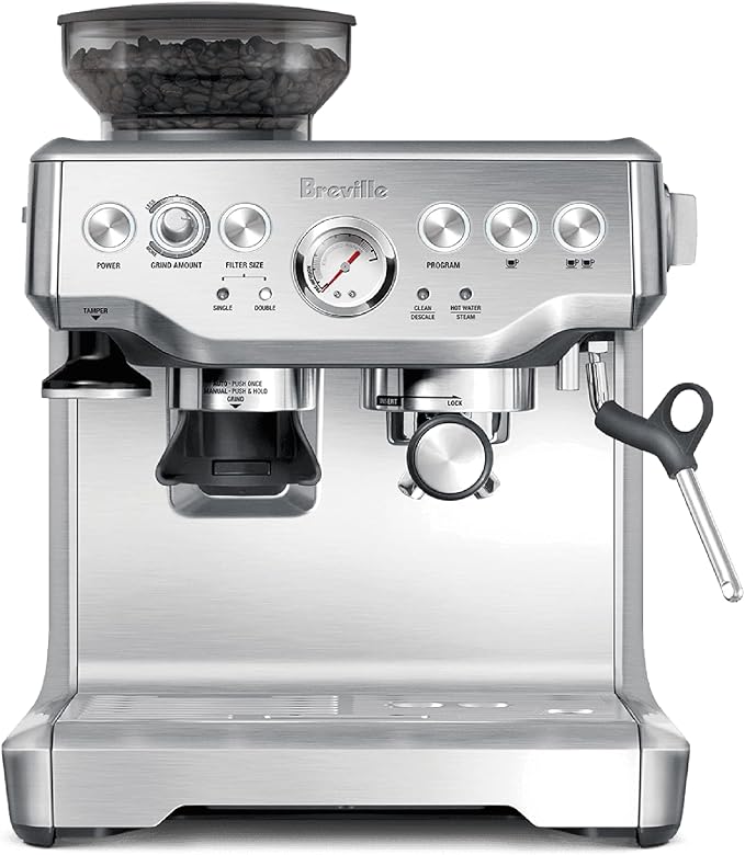 A silver coffee machine with the top of it turned on.