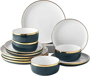 A set of plates and bowls with gold trim.