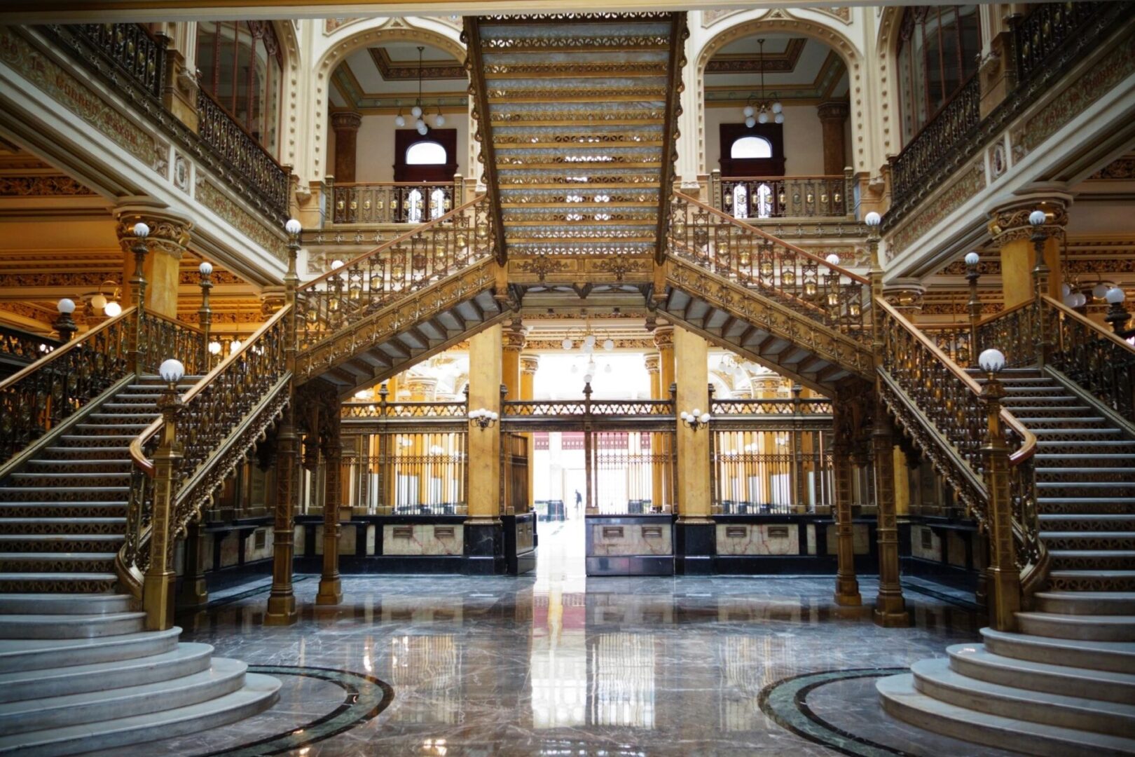 A large lobby with two sets of stairs.