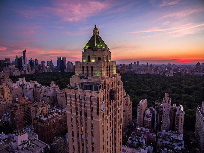 A view of the top of a building at sunset.