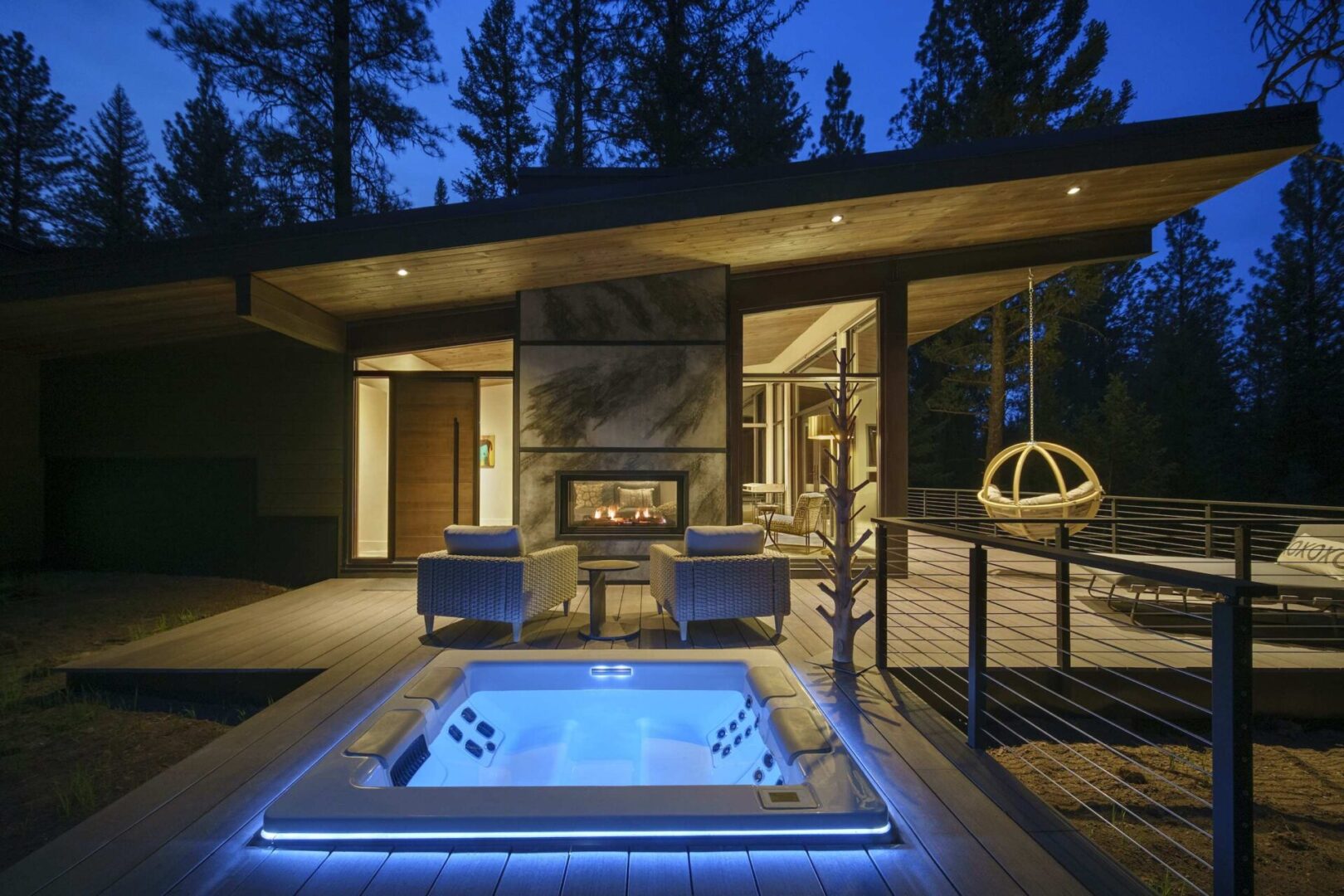 A large outdoor jacuzzi sitting on top of a deck.