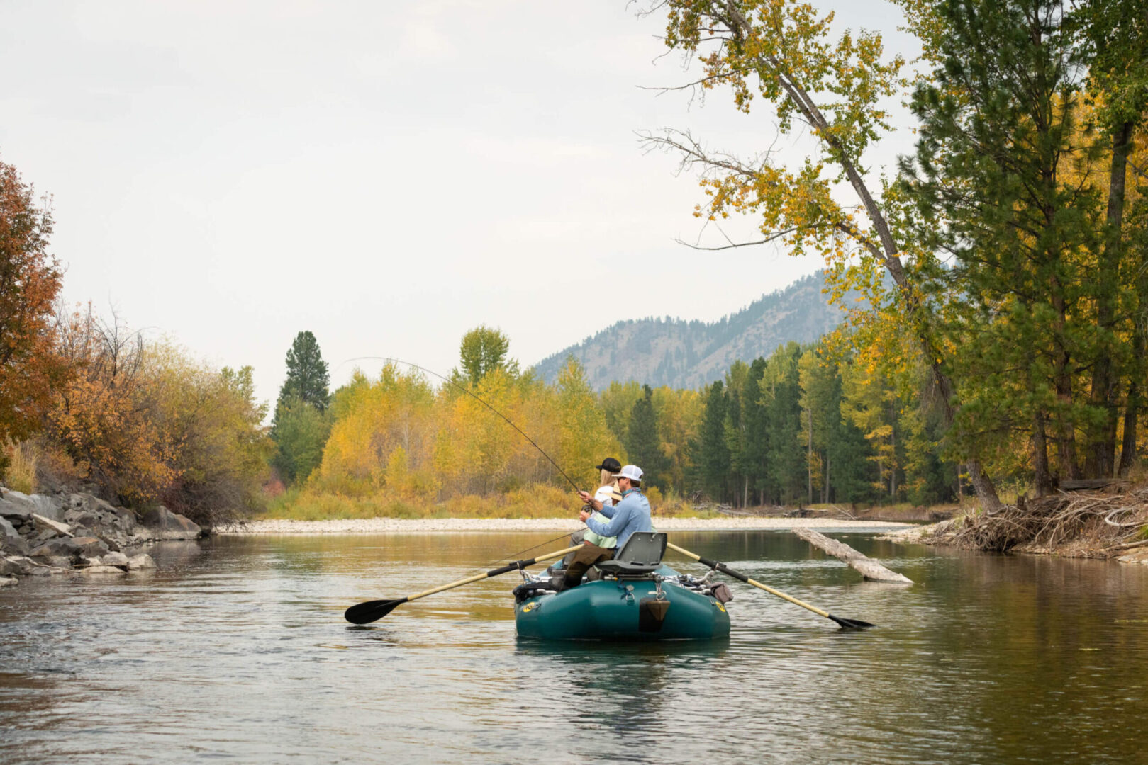 Two people in a canoe on the river.