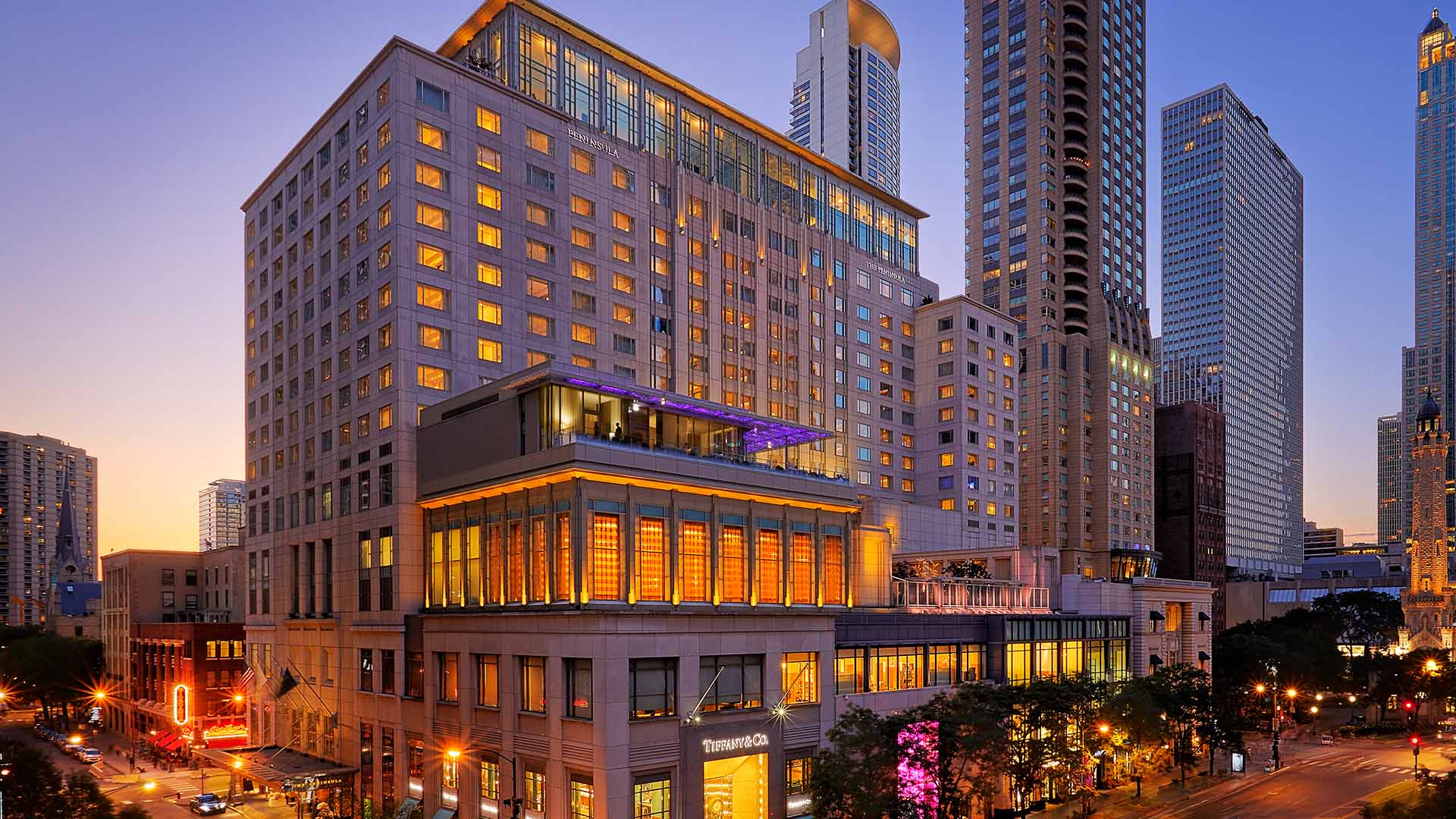 A large building with many windows and lights on it