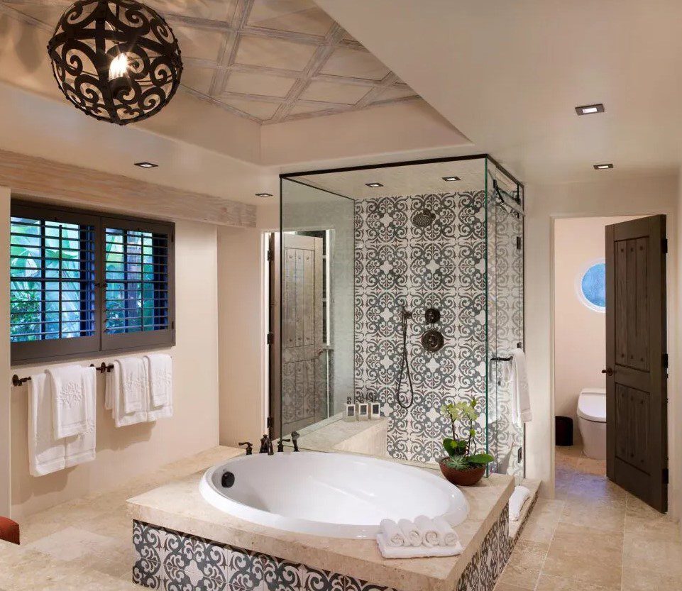 A large bathroom with a tub and shower.