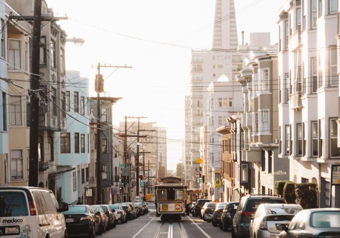 A street car is going down the road.